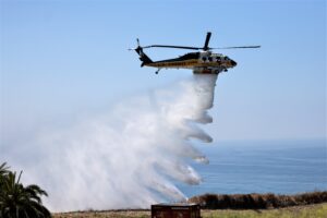 LA County Fire helicopter discharging water picked up from water supply station known as a Helopod